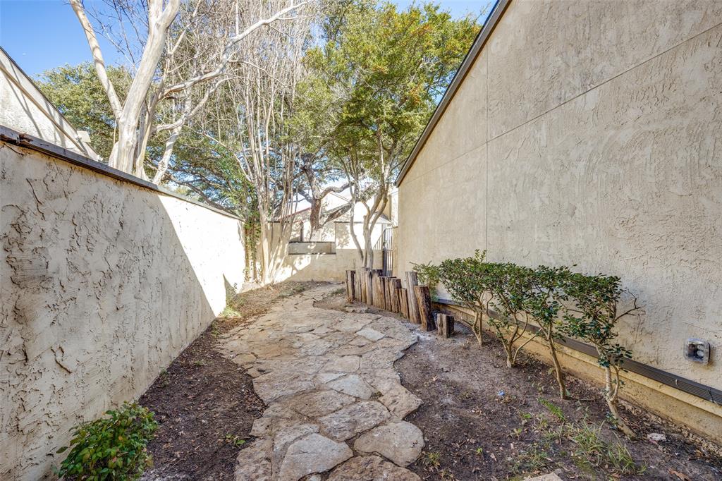 9838 Baseline Drive Dallas, TX 75243 - Photo 29 of 33 a view of a backyard with sitting area