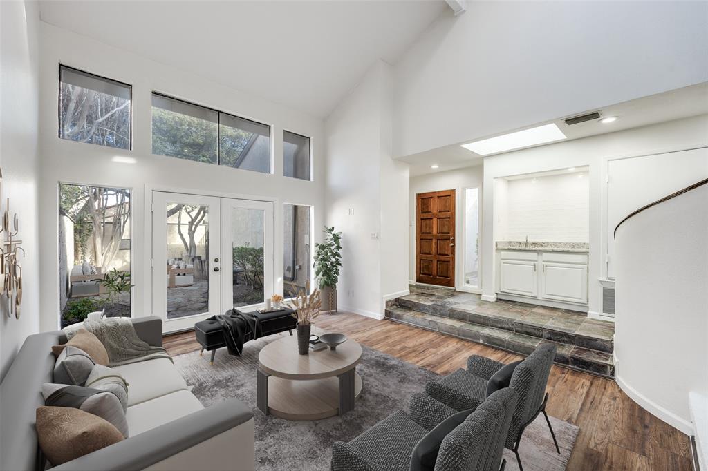 9838 Baseline Drive Dallas, TX 75243 - Photo 5 of 33 a living room with furniture and a large window