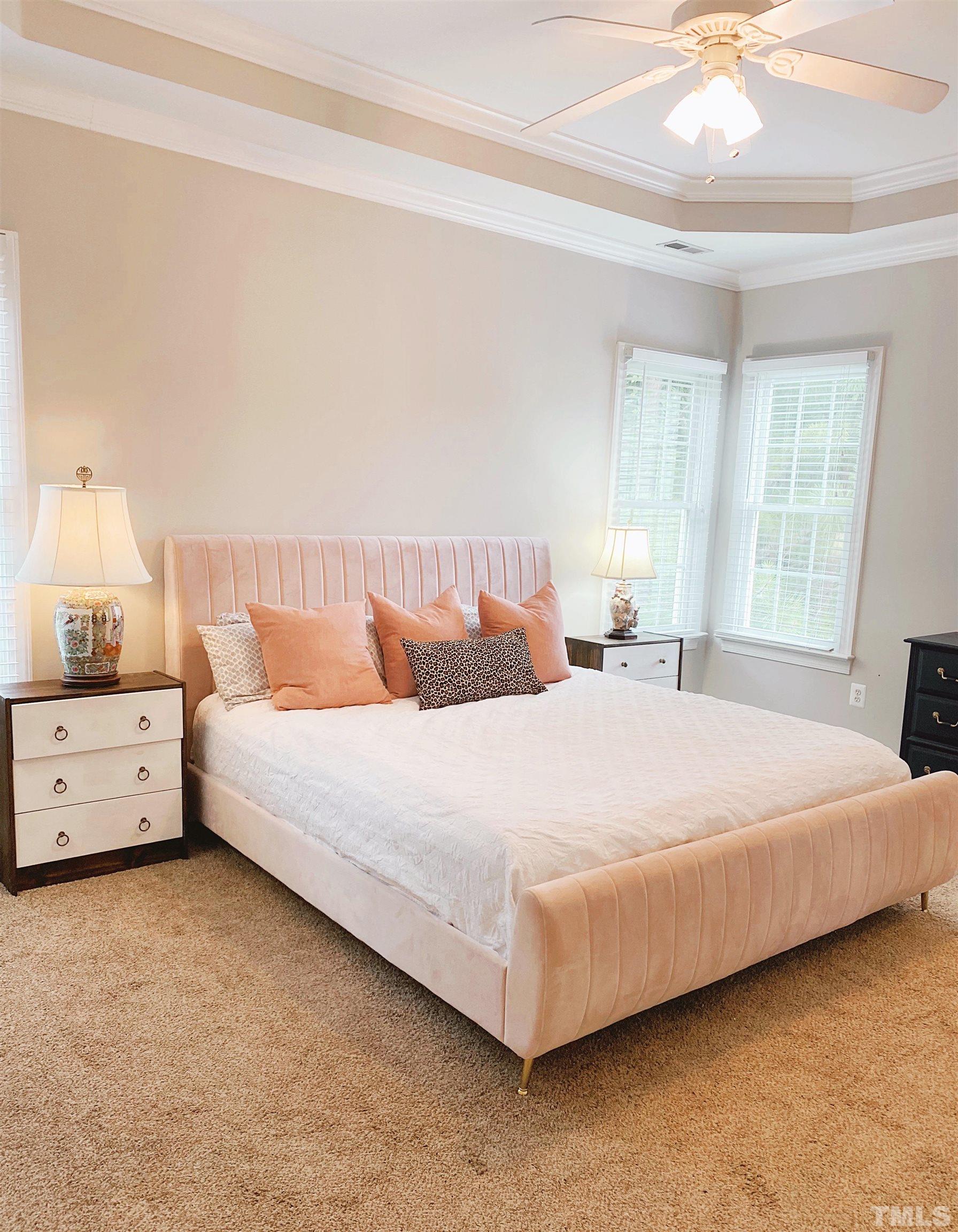 7932 Milltrace Run Raleigh, NC 27615 - Photo 8 of 36 a bedroom with a bed and window