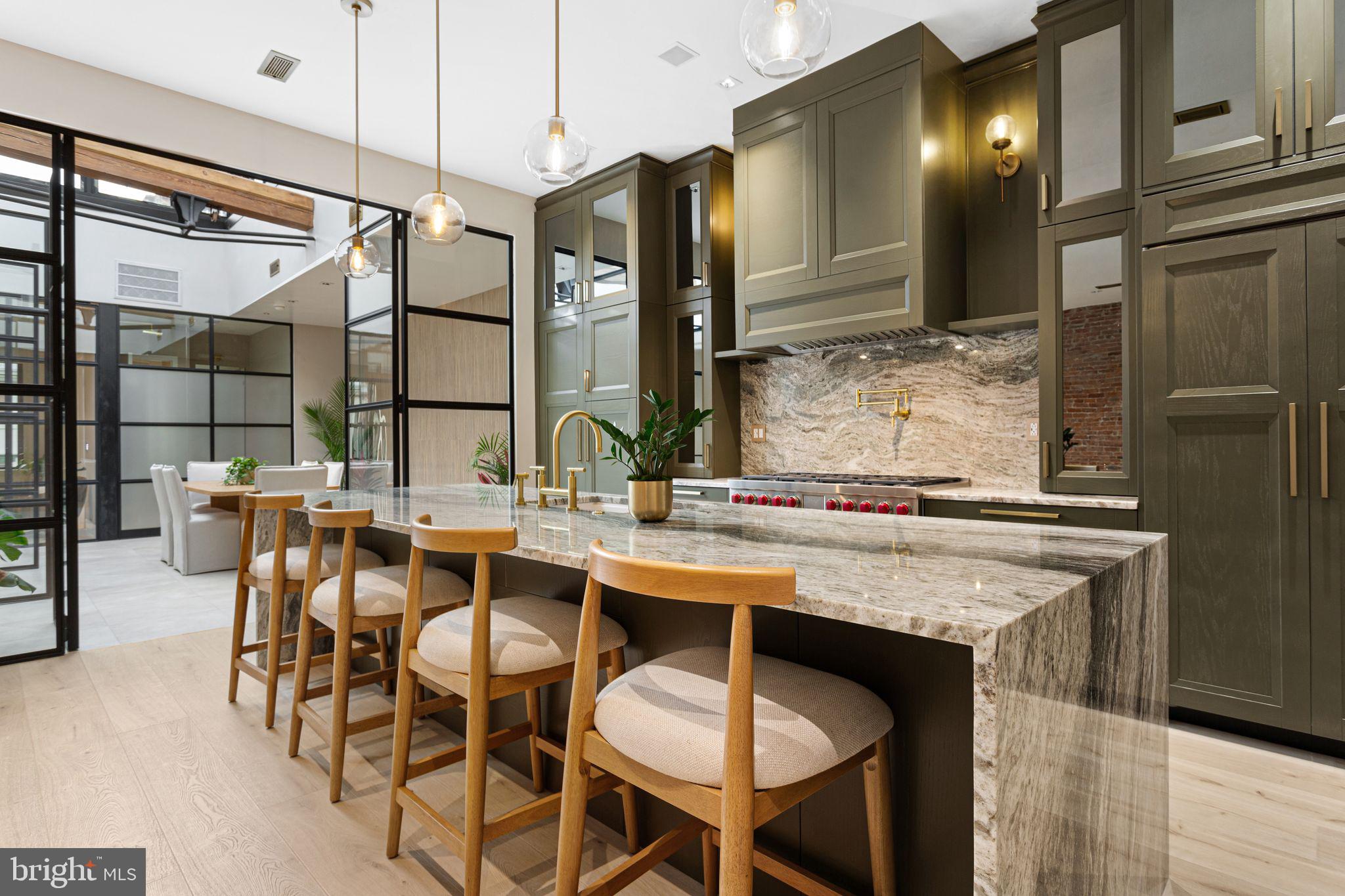 2017 Sansom Street Philadelphia, PA 19103 - Photo 2 of 51 a dining table with chairs and cabinets