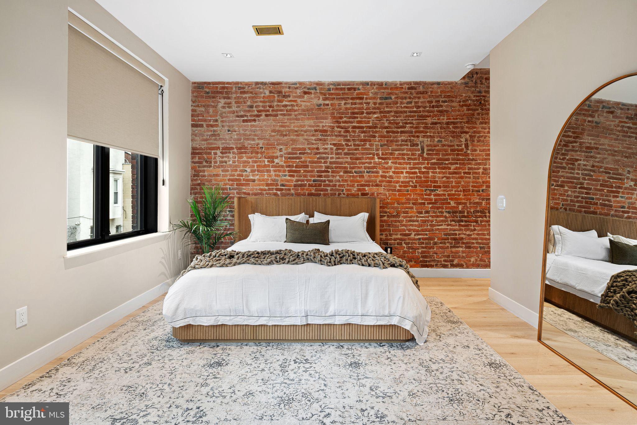 2017 Sansom Street Philadelphia, PA 19103 - Photo 26 of 51 a bed room with a bed and a couch