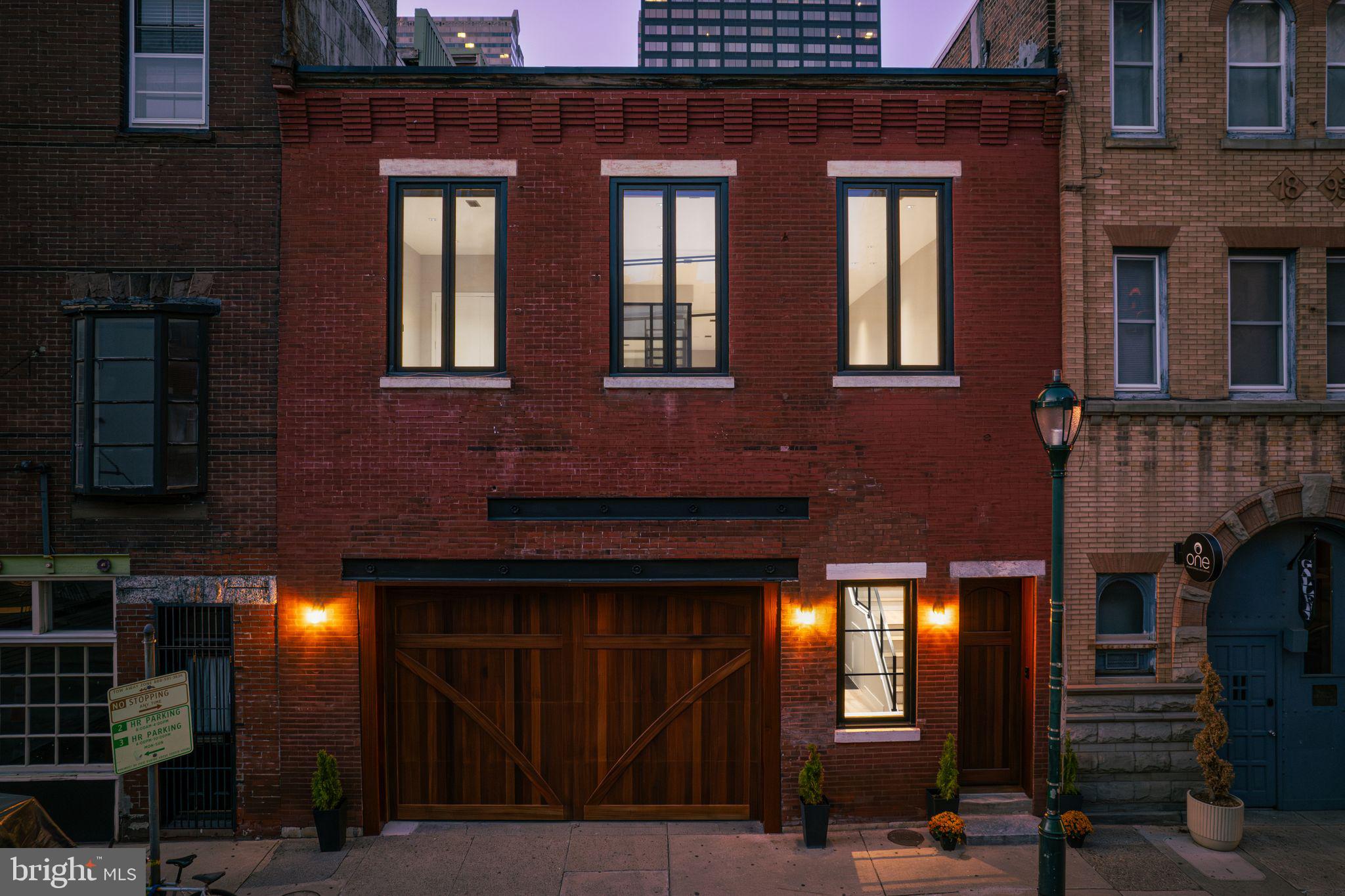 2017 Sansom Street Philadelphia, PA 19103 - Photo 47 of 51 a front view of a house with a yard
