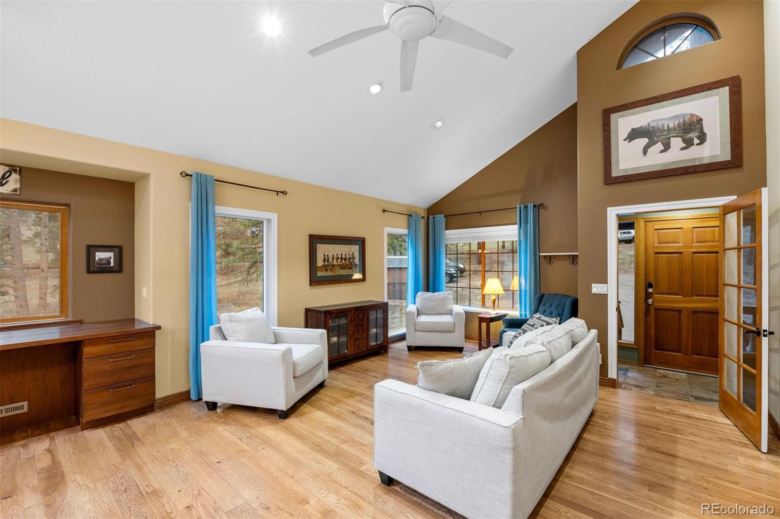 3154 South Piney Ridge Road Evergreen, CO 80439 - Photo 11 of 49 a living room with furniture and a large window