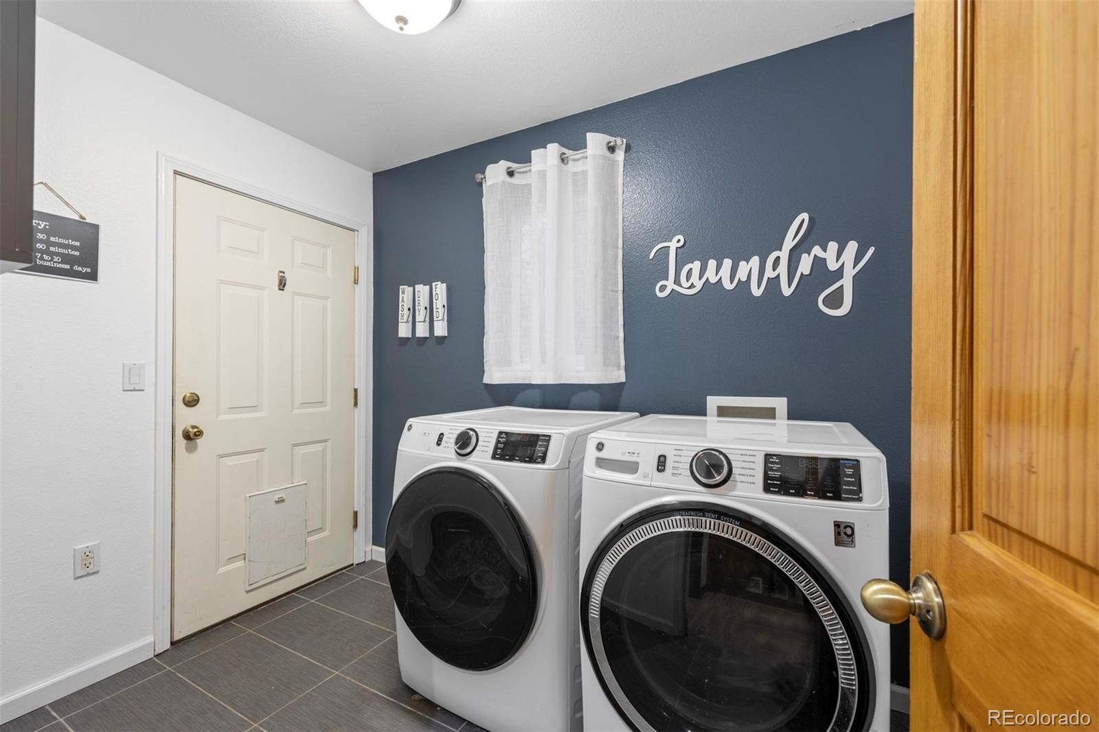 3154 South Piney Ridge Road Evergreen, CO 80439 - Photo 19 of 49 a view of a hallway with washer and dryer
