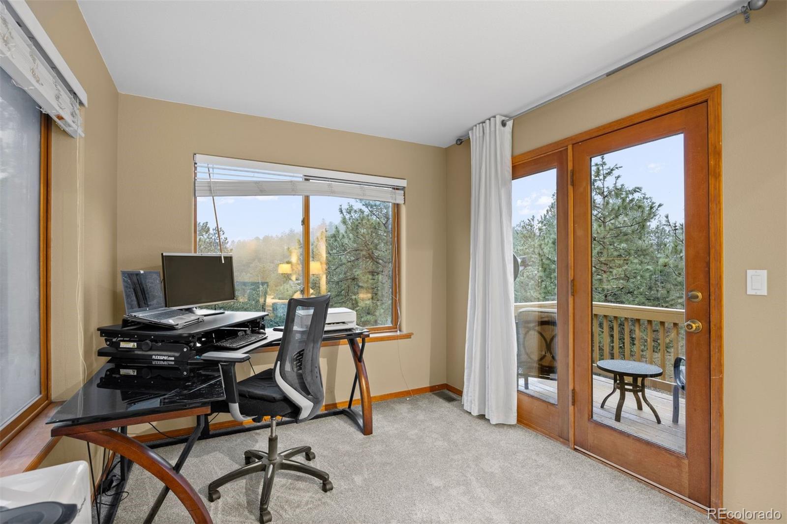 3154 South Piney Ridge Road Evergreen, CO 80439 - Photo 21 of 49 a workspace with furniture and a window