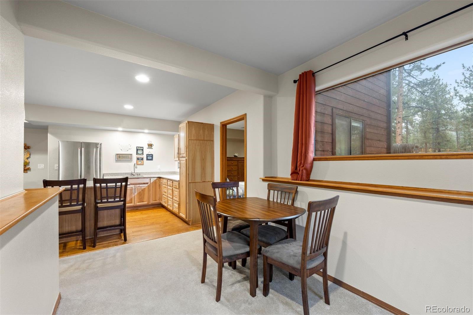 3154 South Piney Ridge Road Evergreen, CO 80439 - Photo 34 of 49 a dining room with furniture and window