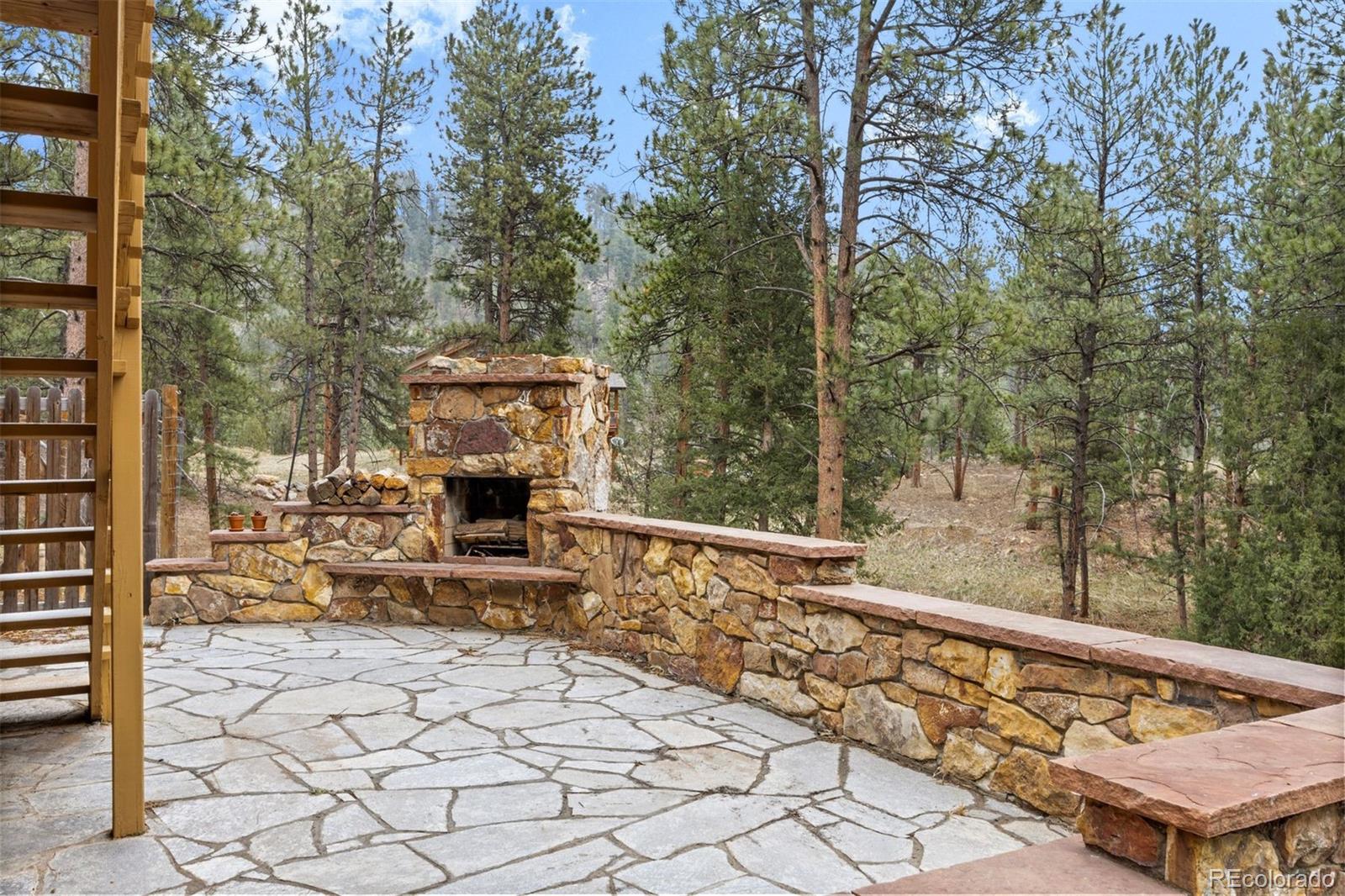 3154 South Piney Ridge Road Evergreen, CO 80439 - Photo 43 of 49 a view of a chairs and tables in the balcony