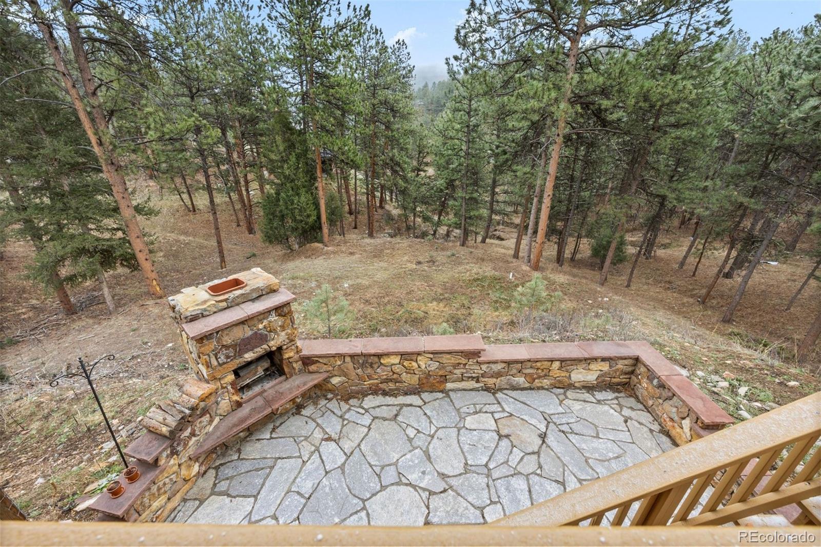 3154 South Piney Ridge Road Evergreen, CO 80439 - Photo 44 of 49 a view of a yard with an outdoor space