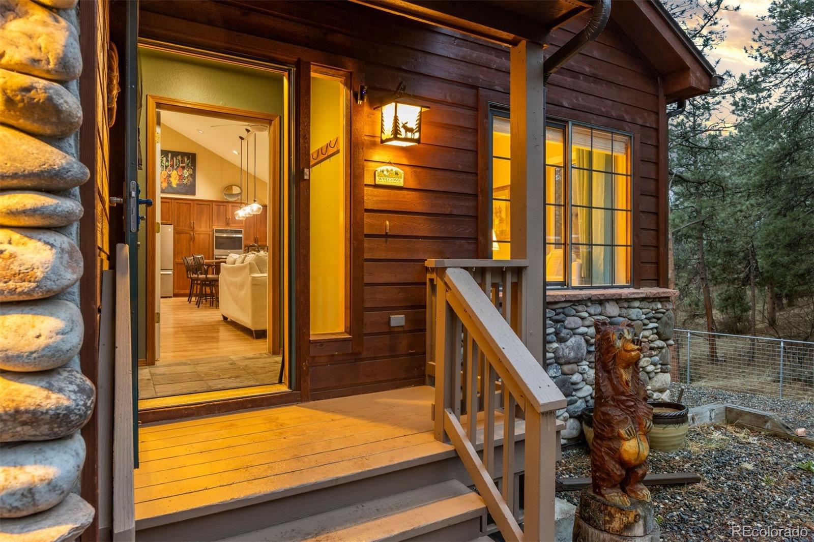 3154 South Piney Ridge Road Evergreen, CO 80439 - Photo 5 of 49 a view of balcony with two flat screen tv