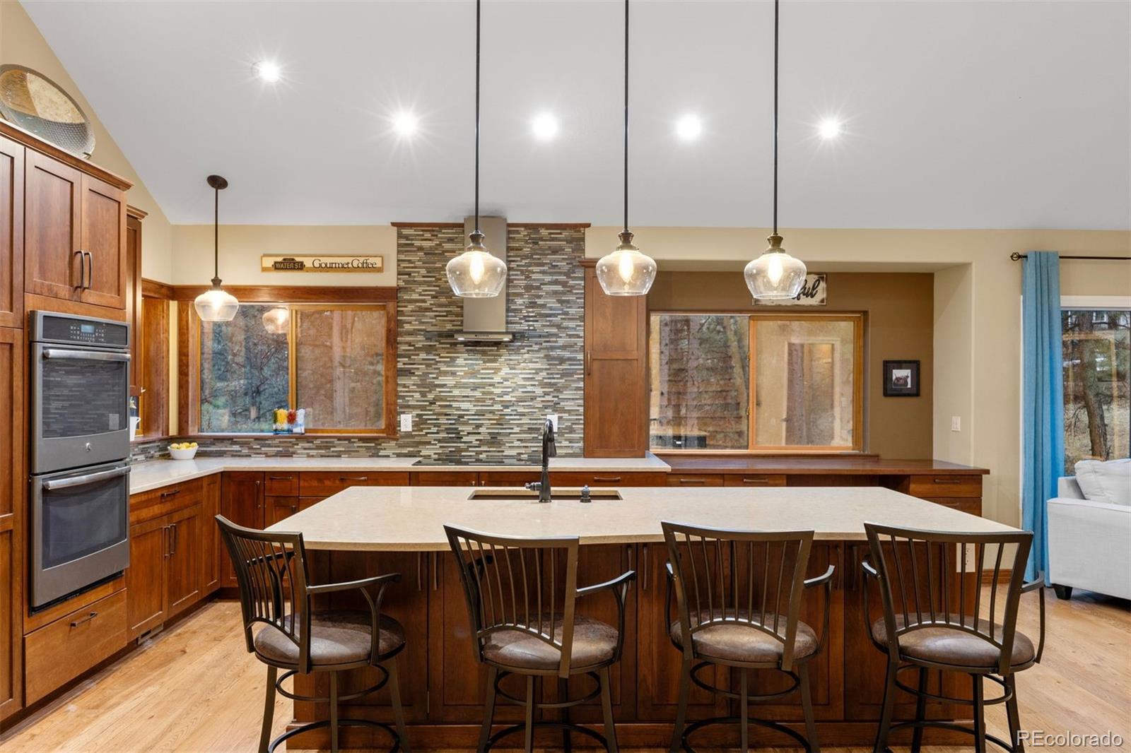 3154 South Piney Ridge Road Evergreen, CO 80439 - Photo 8 of 49 a kitchen with a table and chairs in it