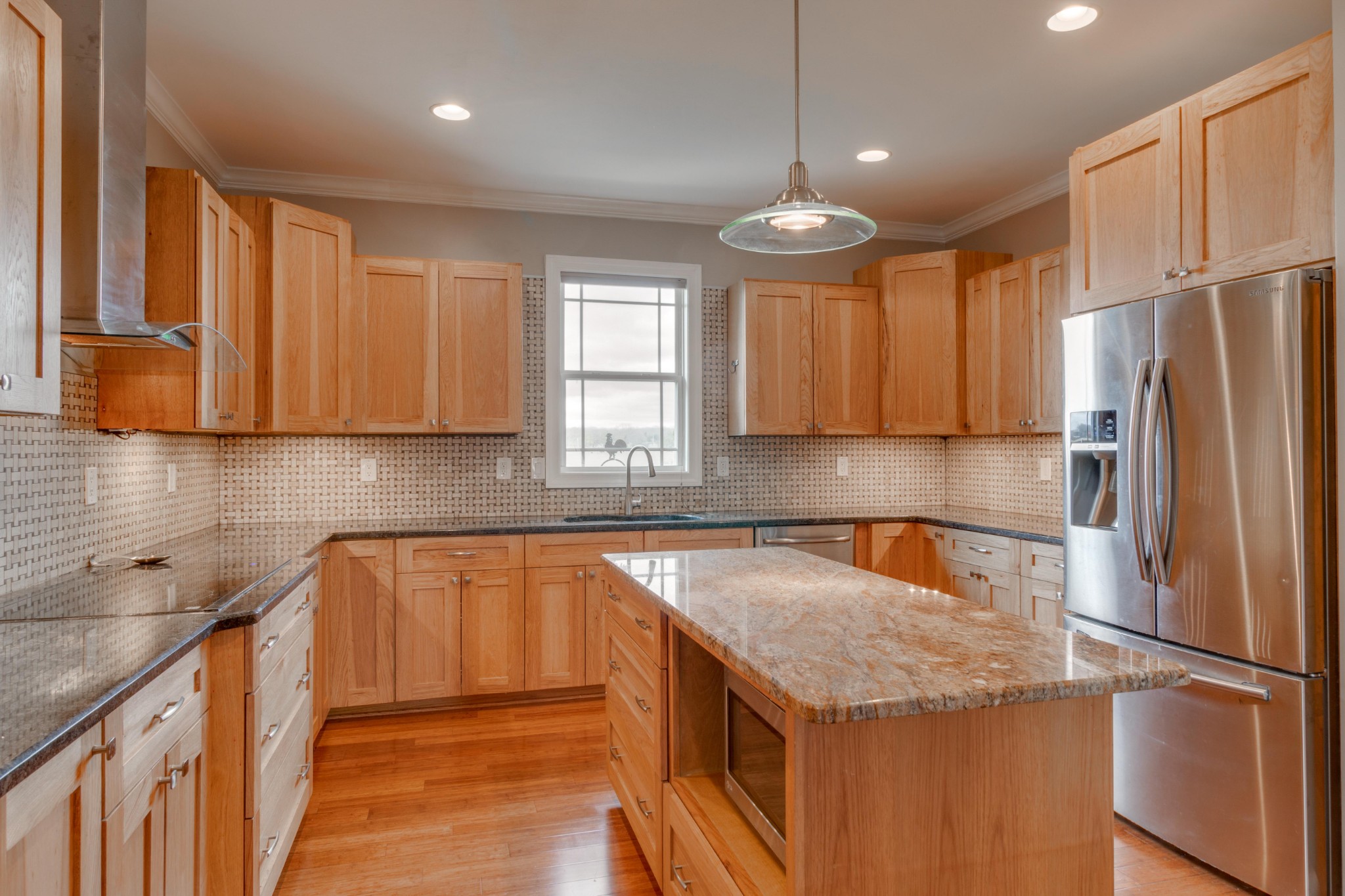 3595 Clark Road Lewisburg, TN 37091 - Photo 11 of 50 a kitchen with stainless steel appliances granite countertop a refrigerator a sink dishwasher a stove with wooden cabinets and floor