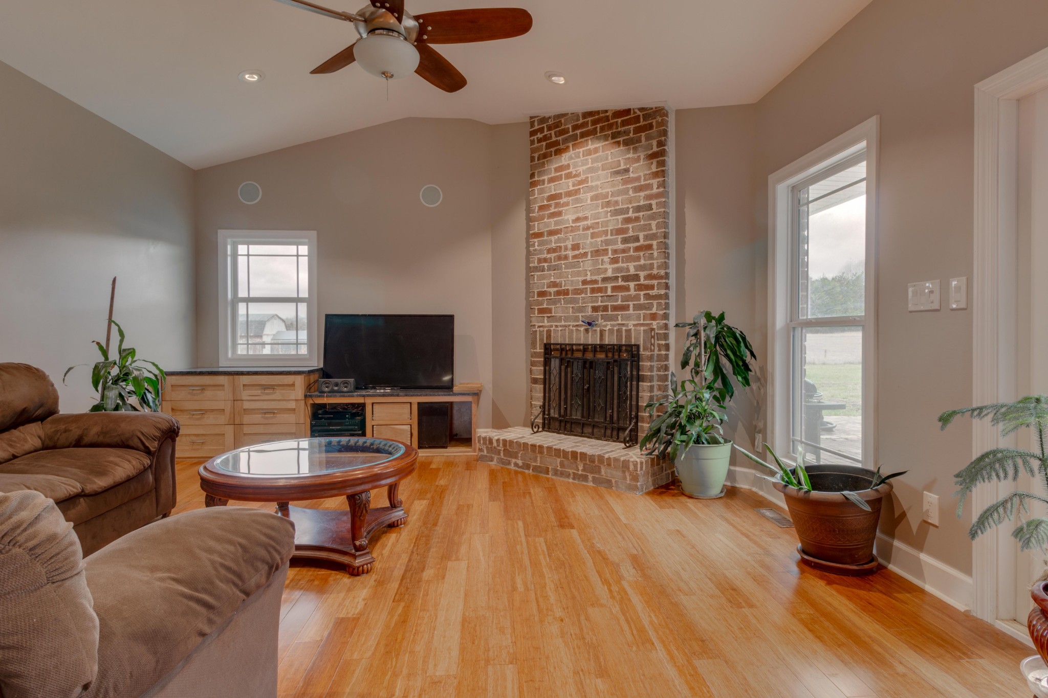 3595 Clark Road Lewisburg, TN 37091 - Photo 14 of 50 a living room with furniture floor to ceiling window and a flat screen tv