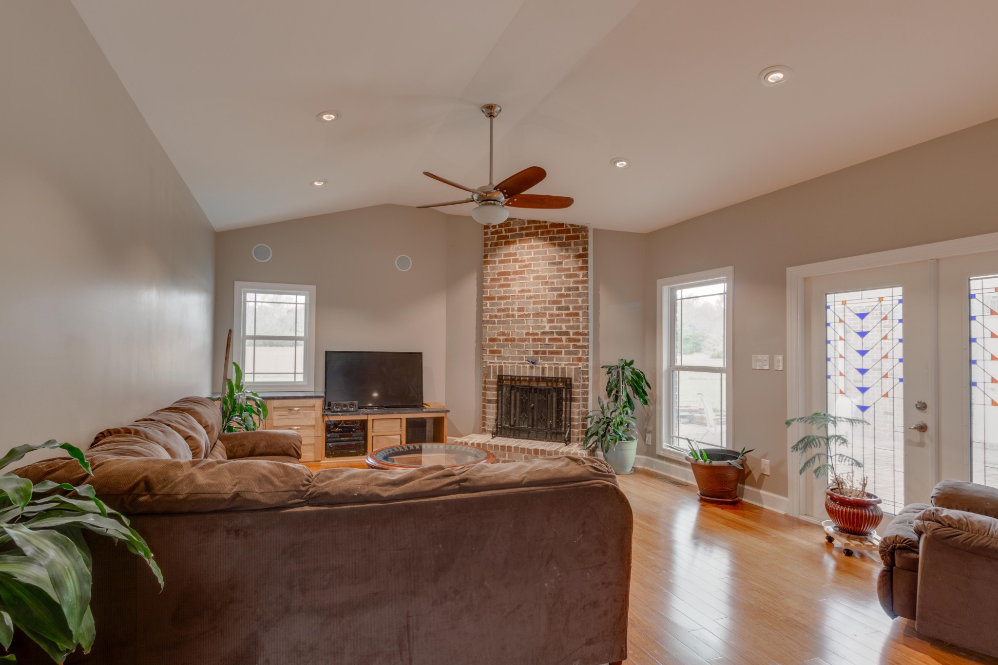 3595 Clark Road Lewisburg, TN 37091 - Photo 16 of 50 a living room with furniture a fireplace and a flat screen tv
