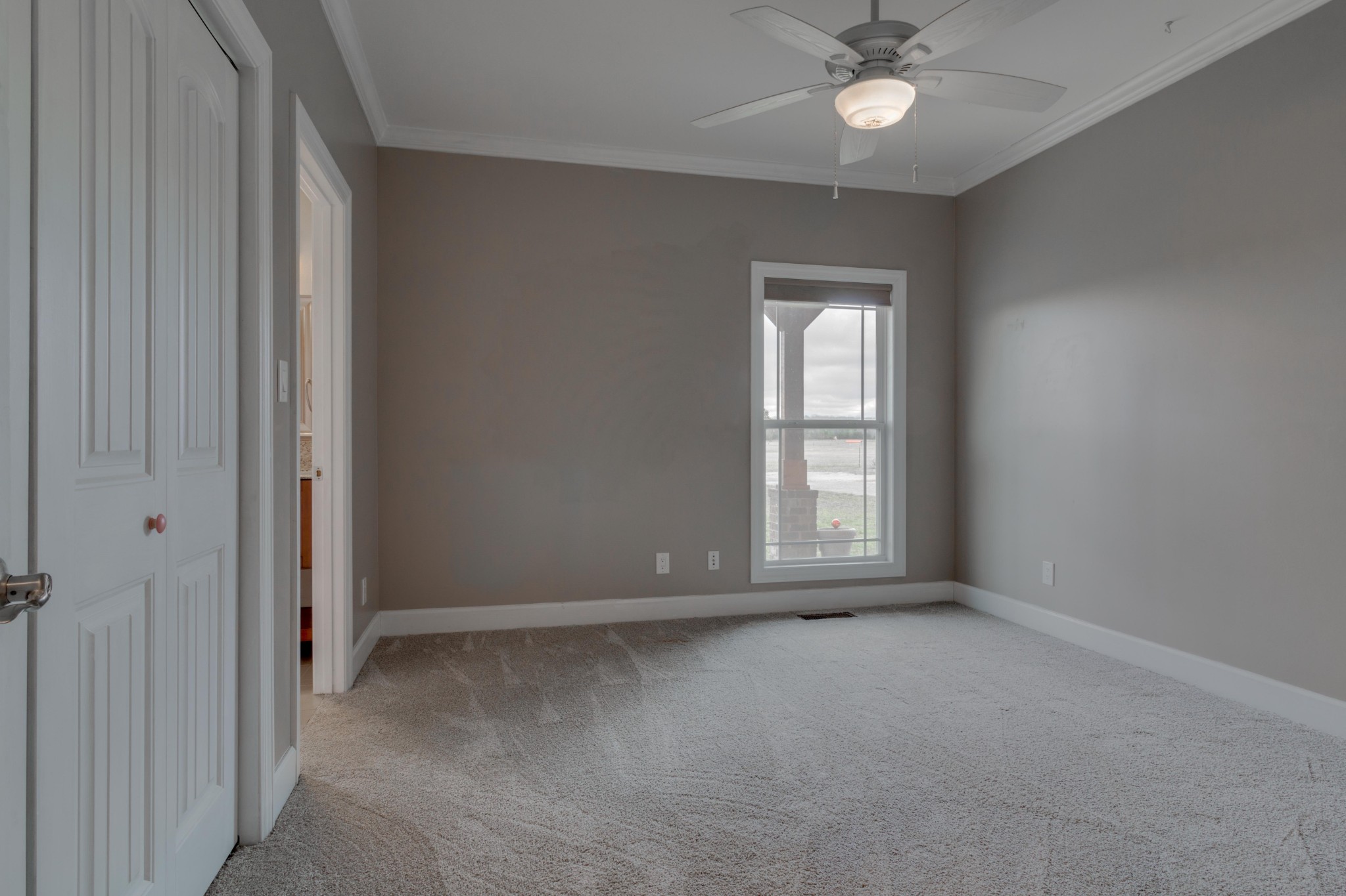 3595 Clark Road Lewisburg, TN 37091 - Photo 24 of 50 an empty room with a chandelier fan and windows