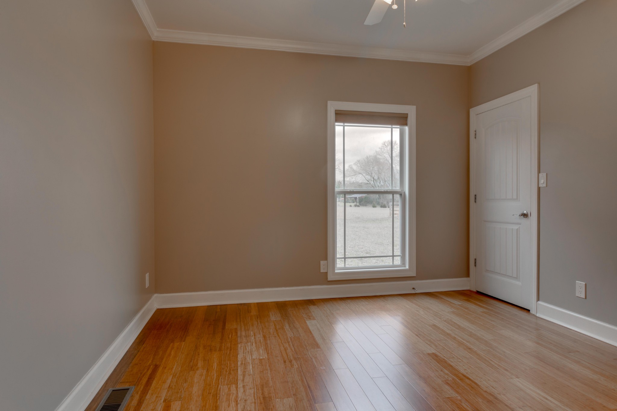 3595 Clark Road Lewisburg, TN 37091 - Photo 27 of 50 an empty room with wooden floor and windows