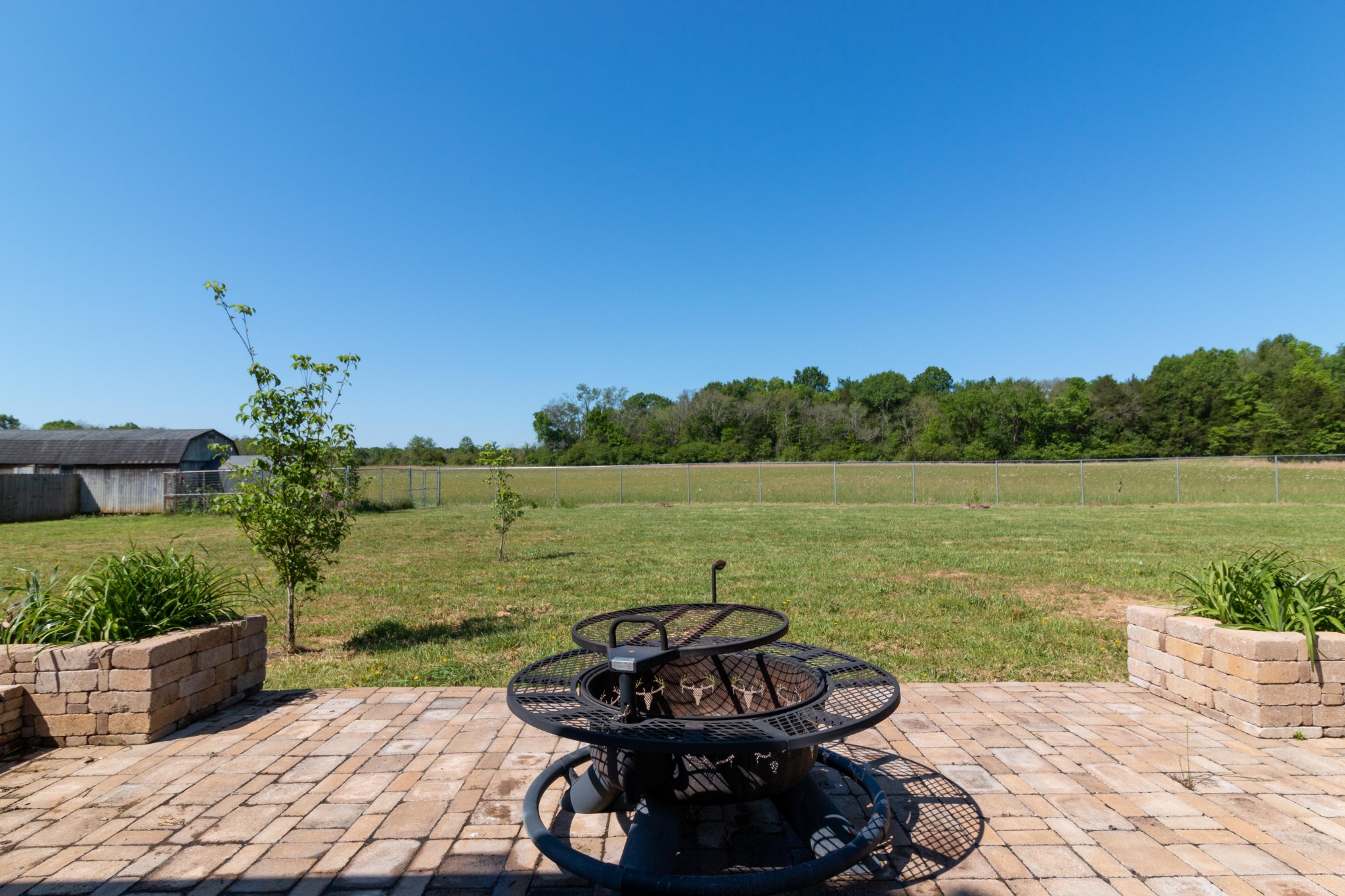 3595 Clark Road Lewisburg, TN 37091 - Photo 43 of 50 a view of a lake with lawn chairs and a potted plant