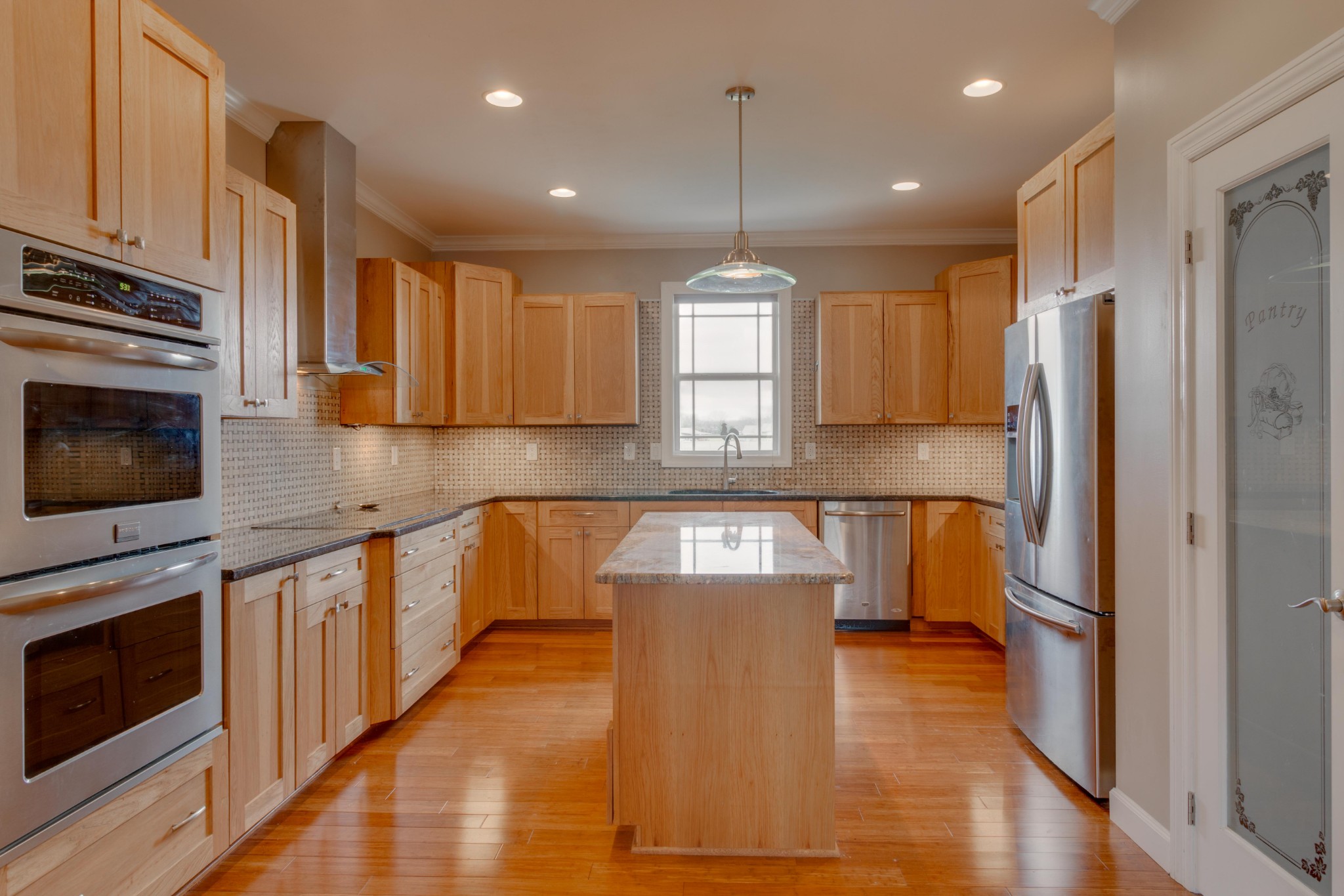 3595 Clark Road Lewisburg, TN 37091 - Photo 7 of 50 a kitchen with stainless steel appliances granite countertop a refrigerator a sink dishwasher a stove and a wooden floor