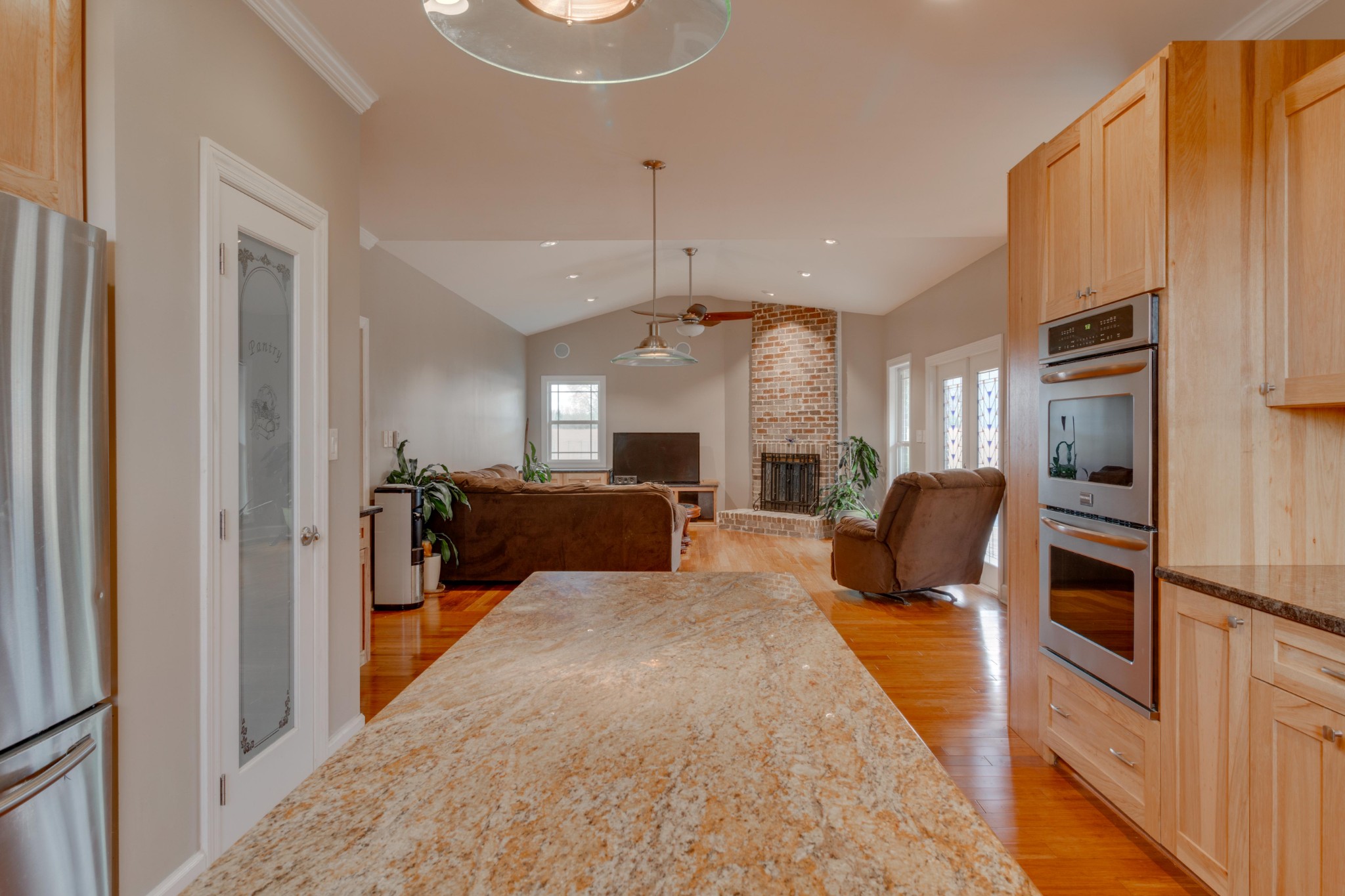 3595 Clark Road Lewisburg, TN 37091 - Photo 9 of 50 a living room with furniture a chandelier and a flat screen tv