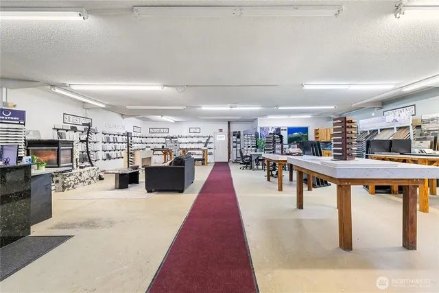 a living room with lots of furniture and a table