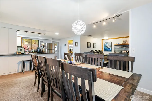 a view of a dining room with furniture and a table