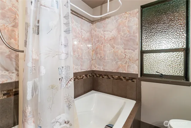 a bathroom with a sink and a shower