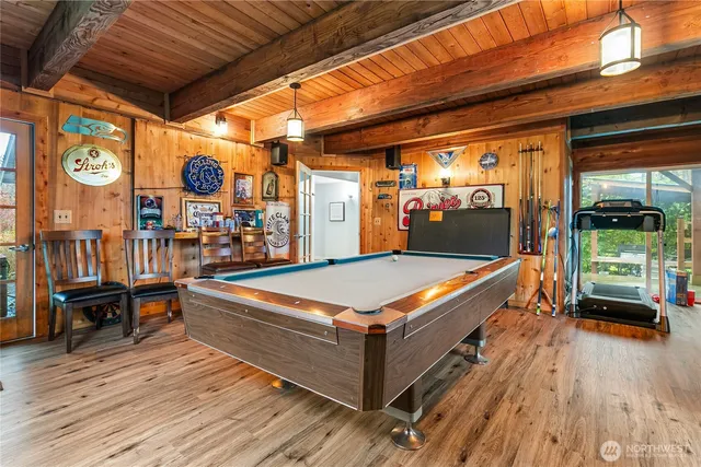 a living room with stainless steel appliances granite countertop lots of furniture