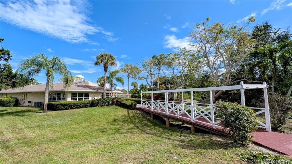 2950 Southeast Ocean Boulevard, Unit 52 Stuart, FL 34996 - Photo 12 of 31 a view of a house with a yard