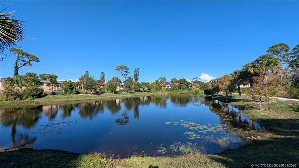 2950 Southeast Ocean Boulevard, Unit 52 Stuart, FL 34996 - Photo 14 of 31 a view of a lake with houses