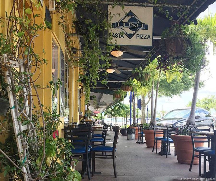 2950 Southeast Ocean Boulevard, Unit 52 Stuart, FL 34996 - Photo 30 of 31 a view of a chairs and table in a patio