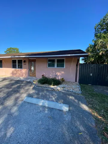 a front view of a house with yard