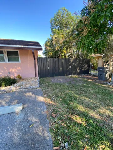 a view of a backyard of the house