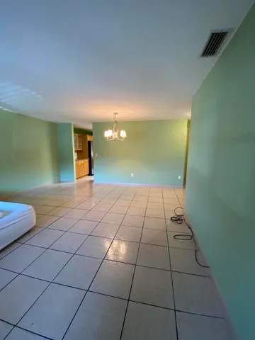 a view of a livingroom with an empty space and a sink