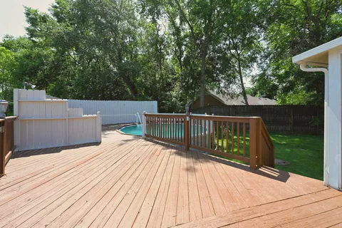 a view of a deck with a yard