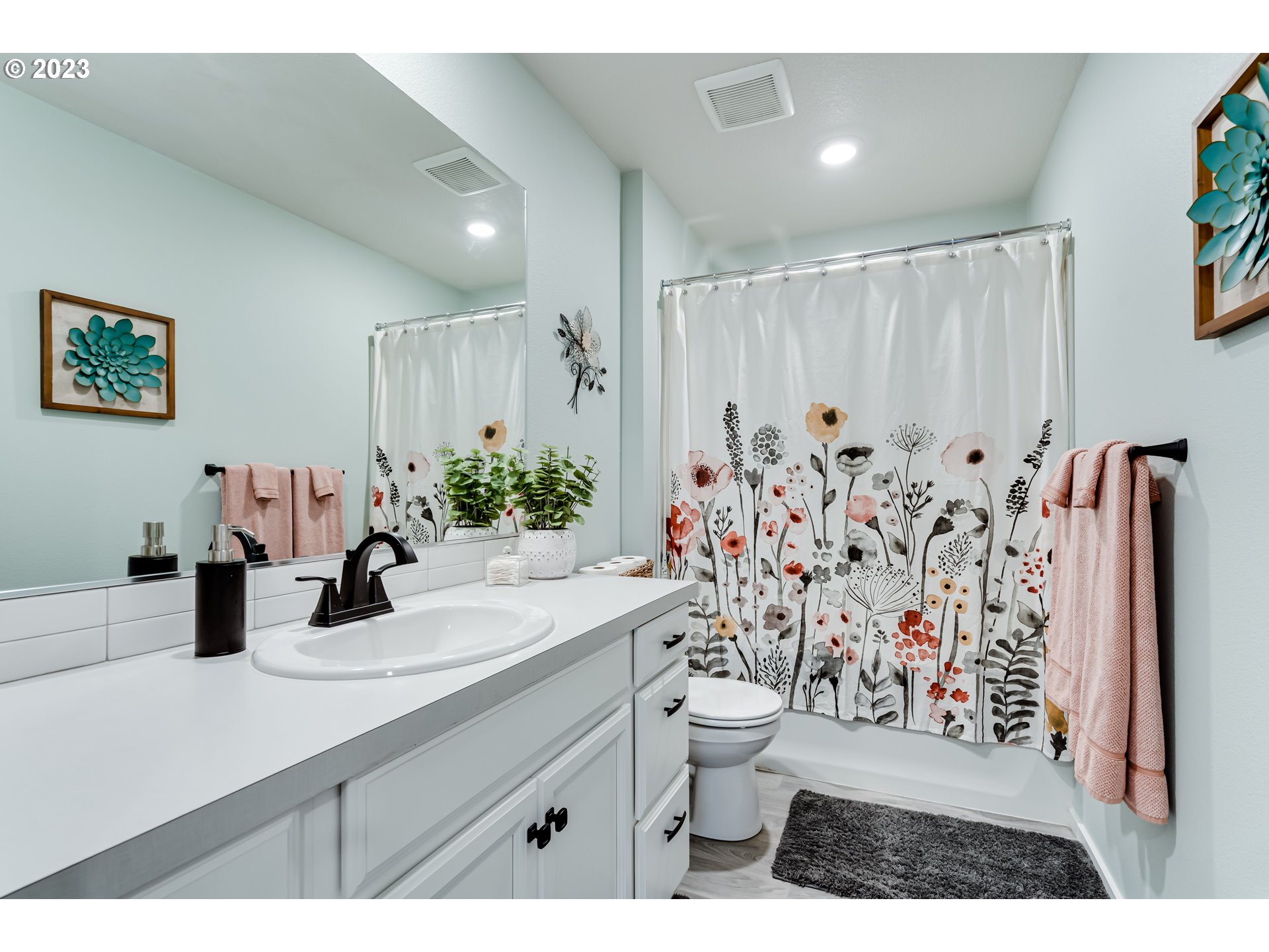 2951 Fenya Street Springfield, OR 97477 - Photo 19 of 32 a bathroom with a sink a toilet and shower curtain