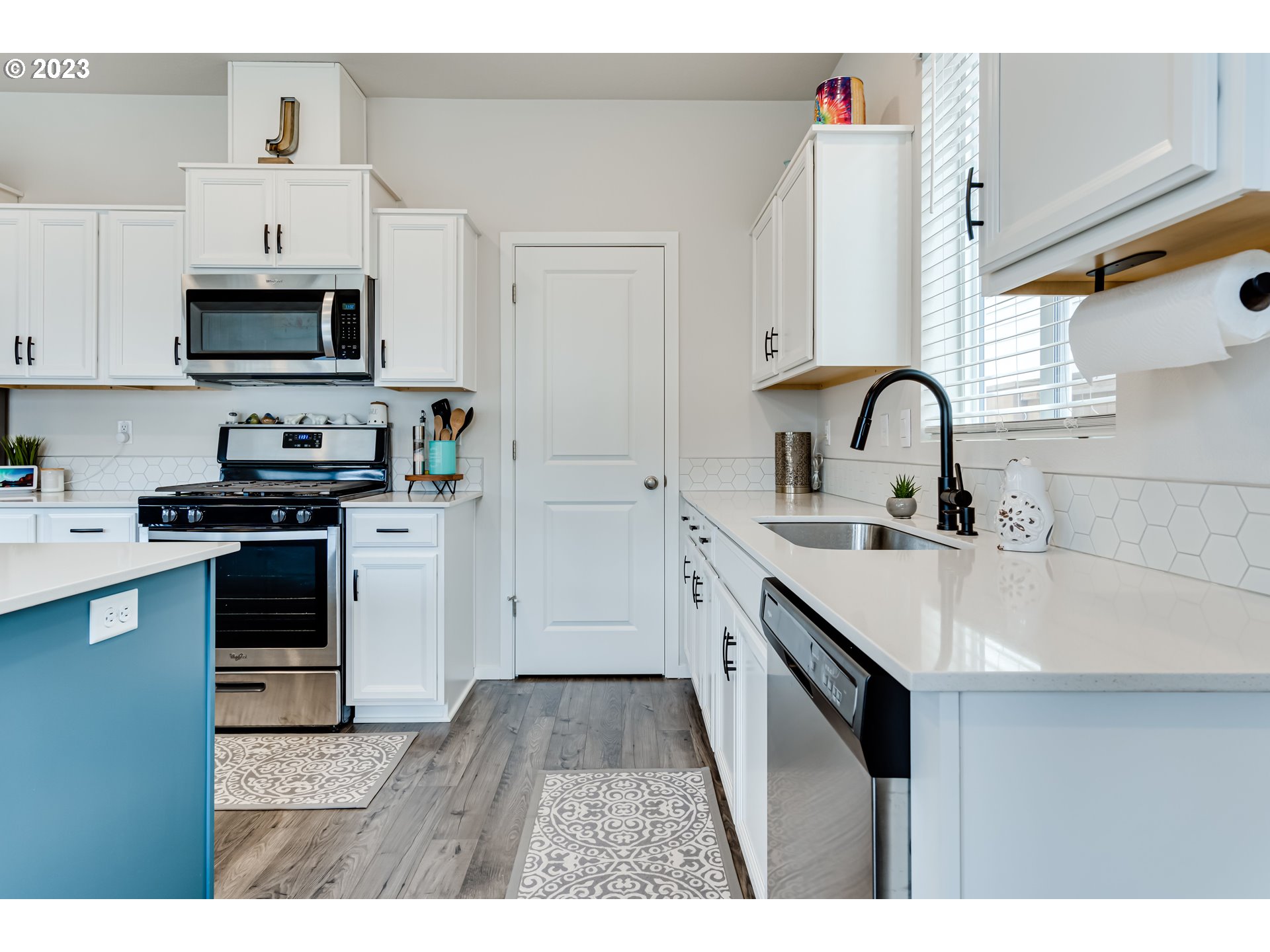 2951 Fenya Street Springfield, OR 97477 - Photo 4 of 32 a kitchen with stainless steel appliances a sink a stove top oven a counter space and cabinets