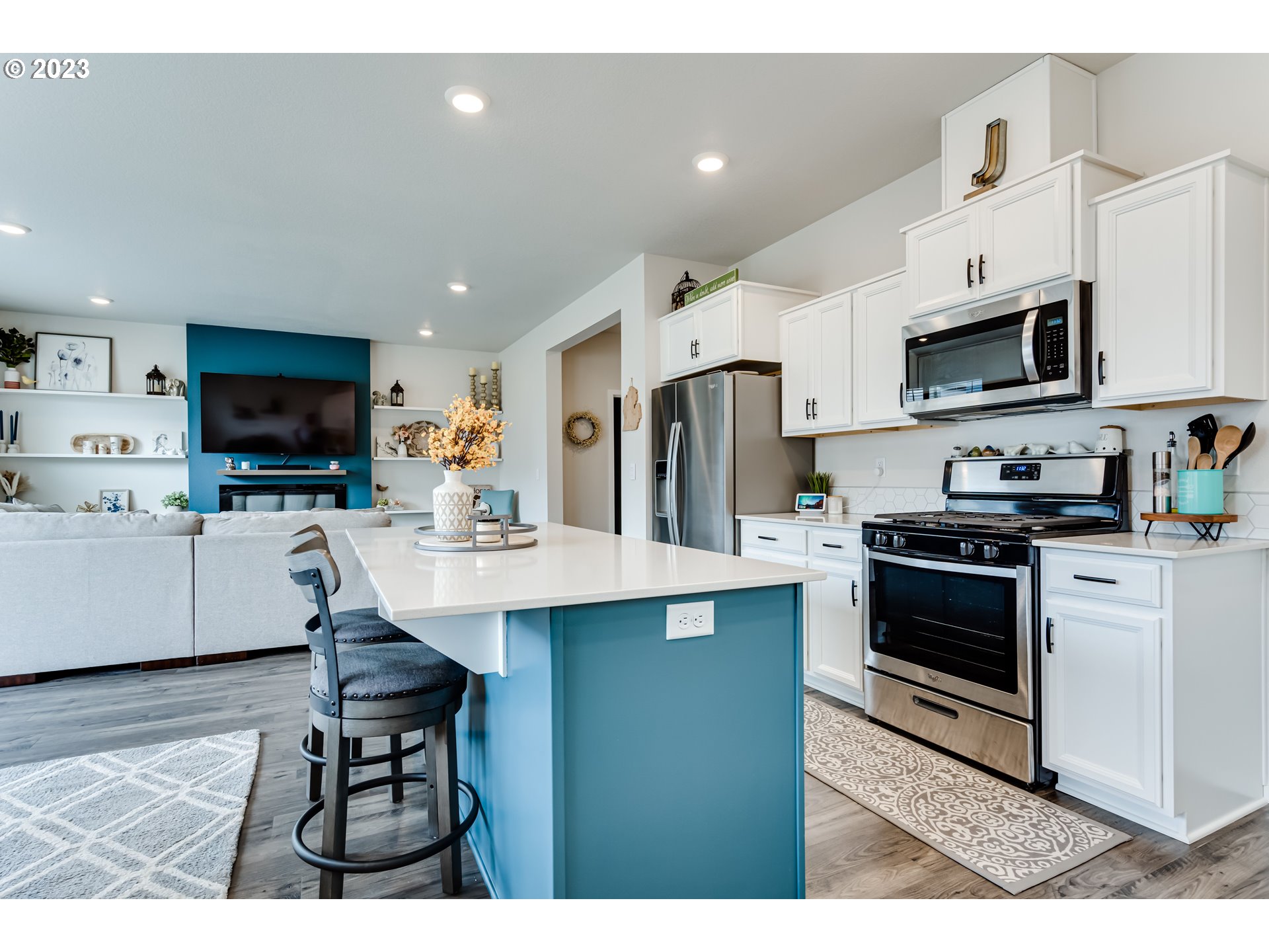 2951 Fenya Street Springfield, OR 97477 - Photo 6 of 32 a kitchen with stainless steel appliances a stove a sink a microwave a refrigerator cabinets and a dining table