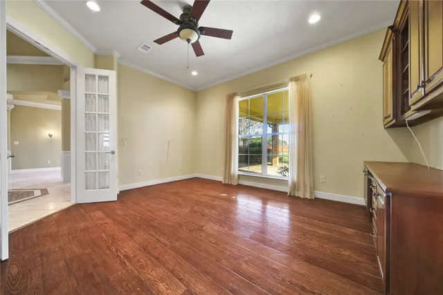 a bathroom with a sink a toilet a mirror and vanity