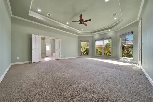 a kitchen with cabinets and window