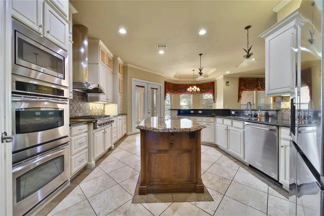 a view of a livingroom with furniture wooden floor and a window