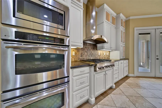 a view of a livingroom with fireplace and window
