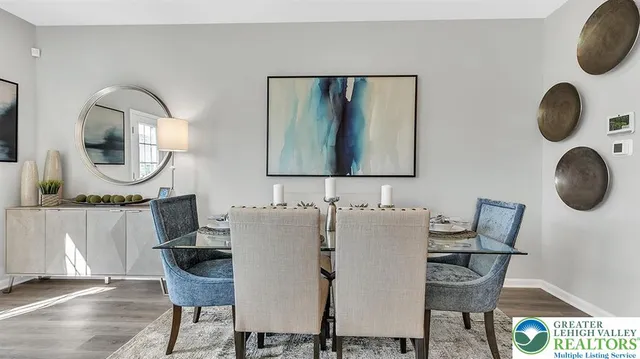 a view of a kitchen with wooden floor and electronic appliances