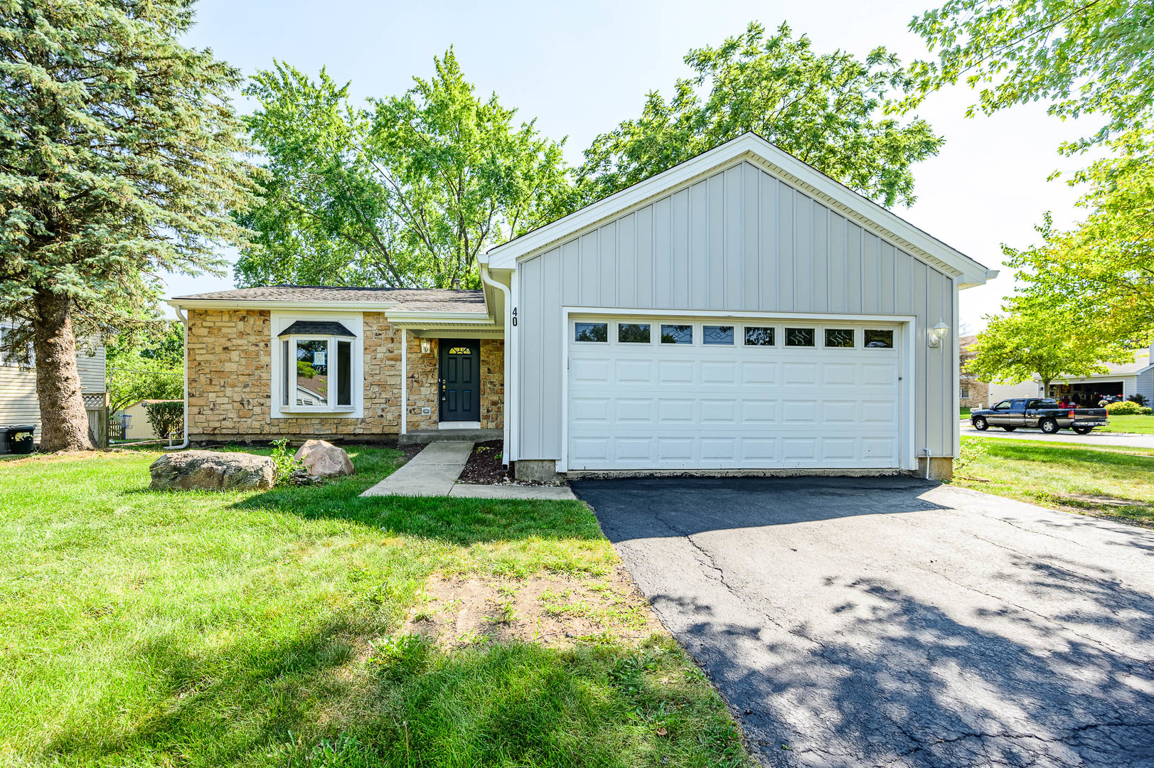 40 Fallstone Drive Streamwood, IL 60107 - Photo 1 of 13 a front view of house with yard and green space
