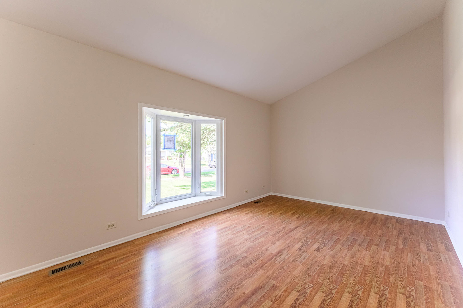 40 Fallstone Drive Streamwood, IL 60107 - Photo 2 of 13 an empty room with wooden floor and windows