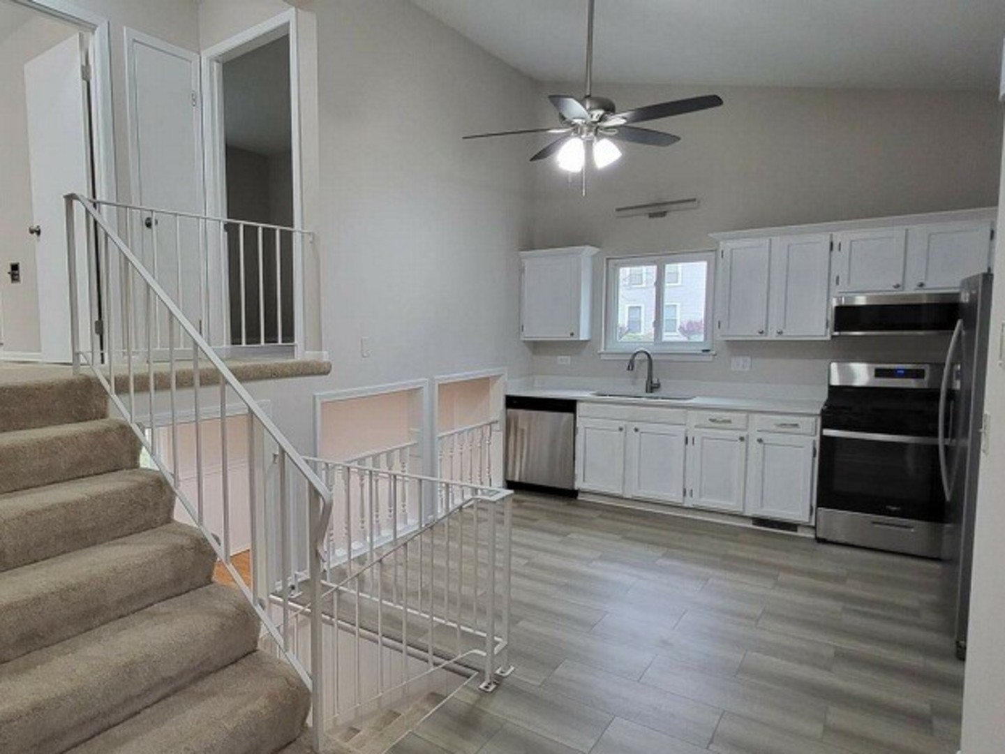 40 Fallstone Drive Streamwood, IL 60107 - Photo 3 of 13 a kitchen with cabinets a sink and appliances