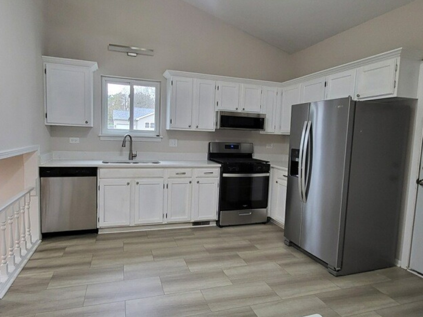 40 Fallstone Drive Streamwood, IL 60107 - Photo 4 of 13 a kitchen with stainless steel appliances a refrigerator stove and sink