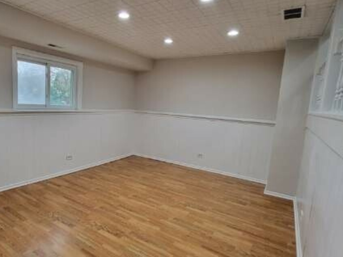 40 Fallstone Drive Streamwood, IL 60107 - Photo 8 of 13 a view of empty room with wooden floor and fan