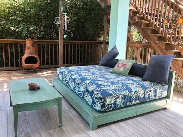 a bedroom with a bed and a night stand