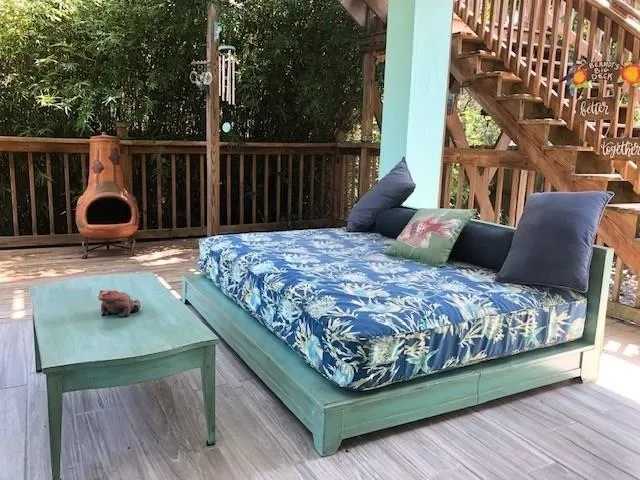 a bedroom with a bed and a night stand