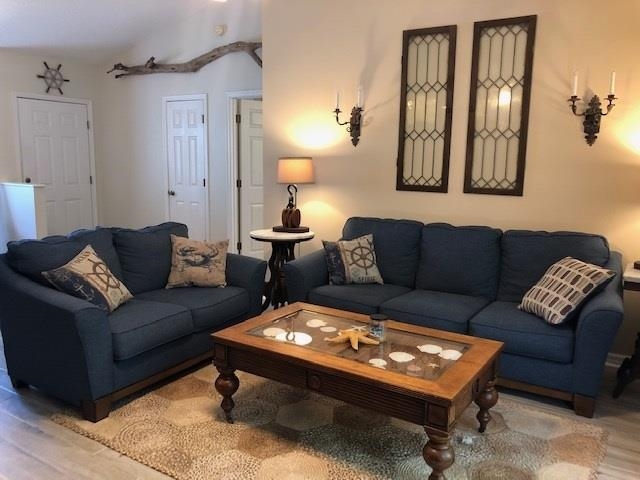 84 Aloha Circle St. Augustine, FL 32080 - Photo 2 of 18 a living room with furniture and a table