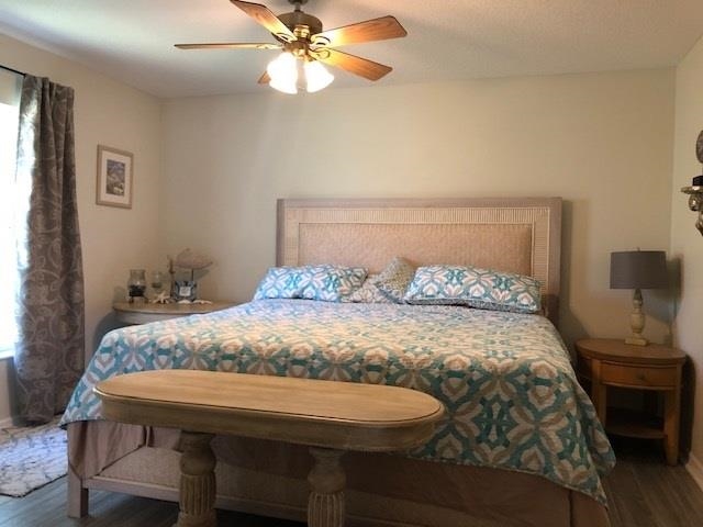 84 Aloha Circle St. Augustine, FL 32080 - Photo 9 of 18 a bedroom with a bed and a chandelier